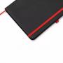 Черен бележник с контрастни цветни елементи